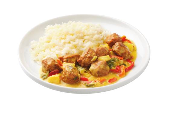 Geflügelbällchen in gelber Currysauce